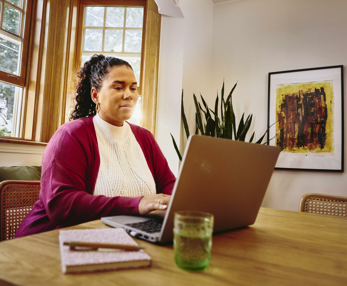 female at work using laptop