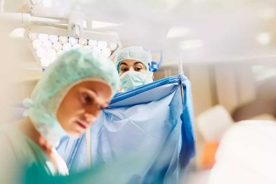 Doctors in a surgery room. 
